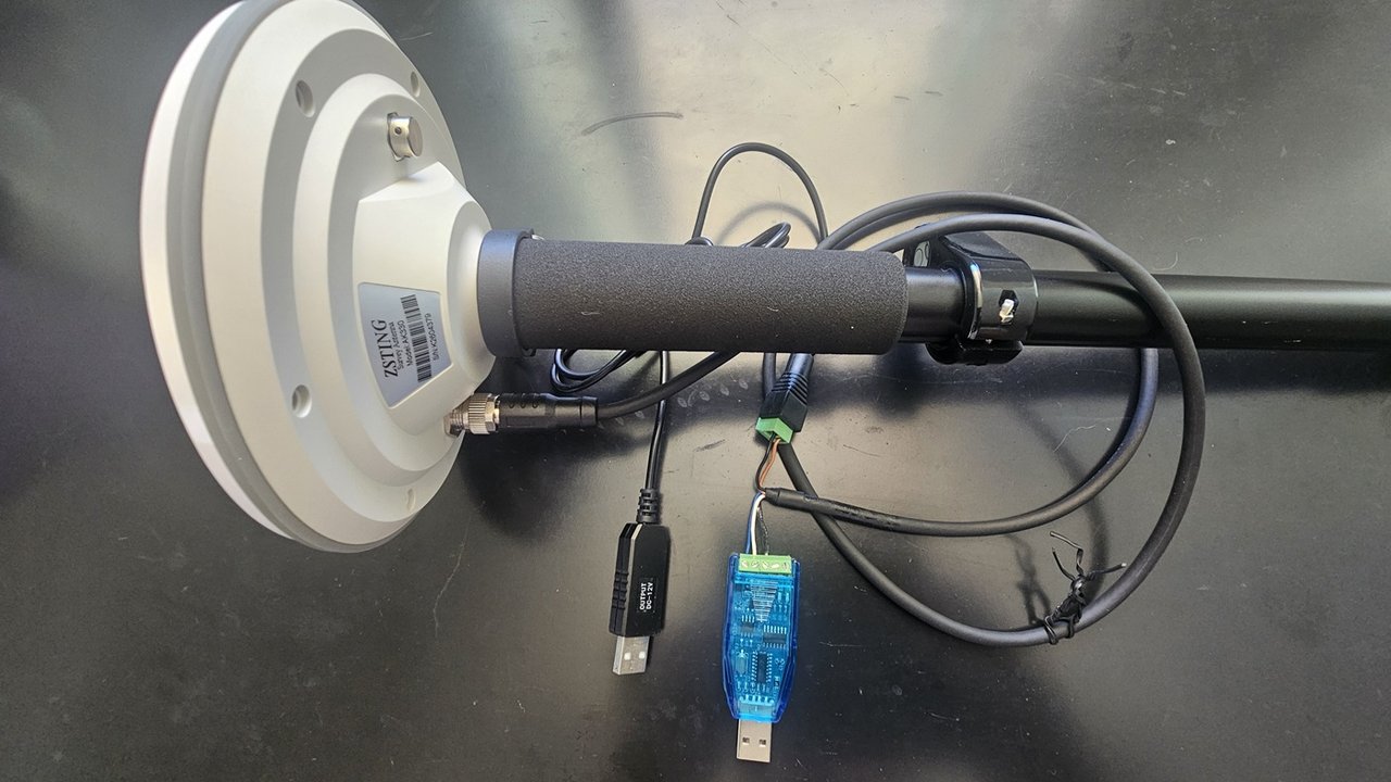 AK330 antenna mounted on the pole, with the aviation cable connected, the 12 V USB cable and the USB-RS485 converter wired to the cable
